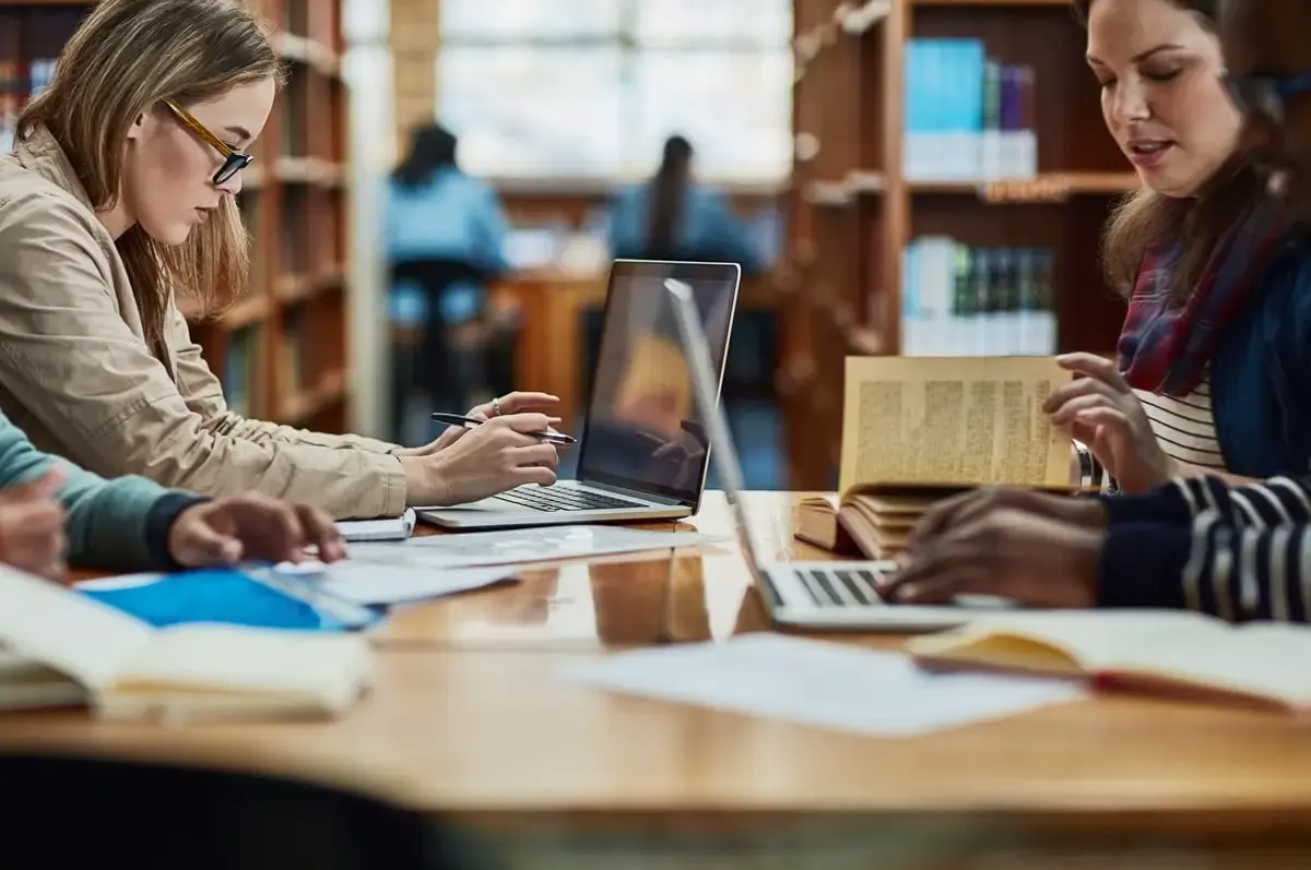 Scholar formatting an academic manuscript using standardized citation style guidelines and scholarly writing practices.