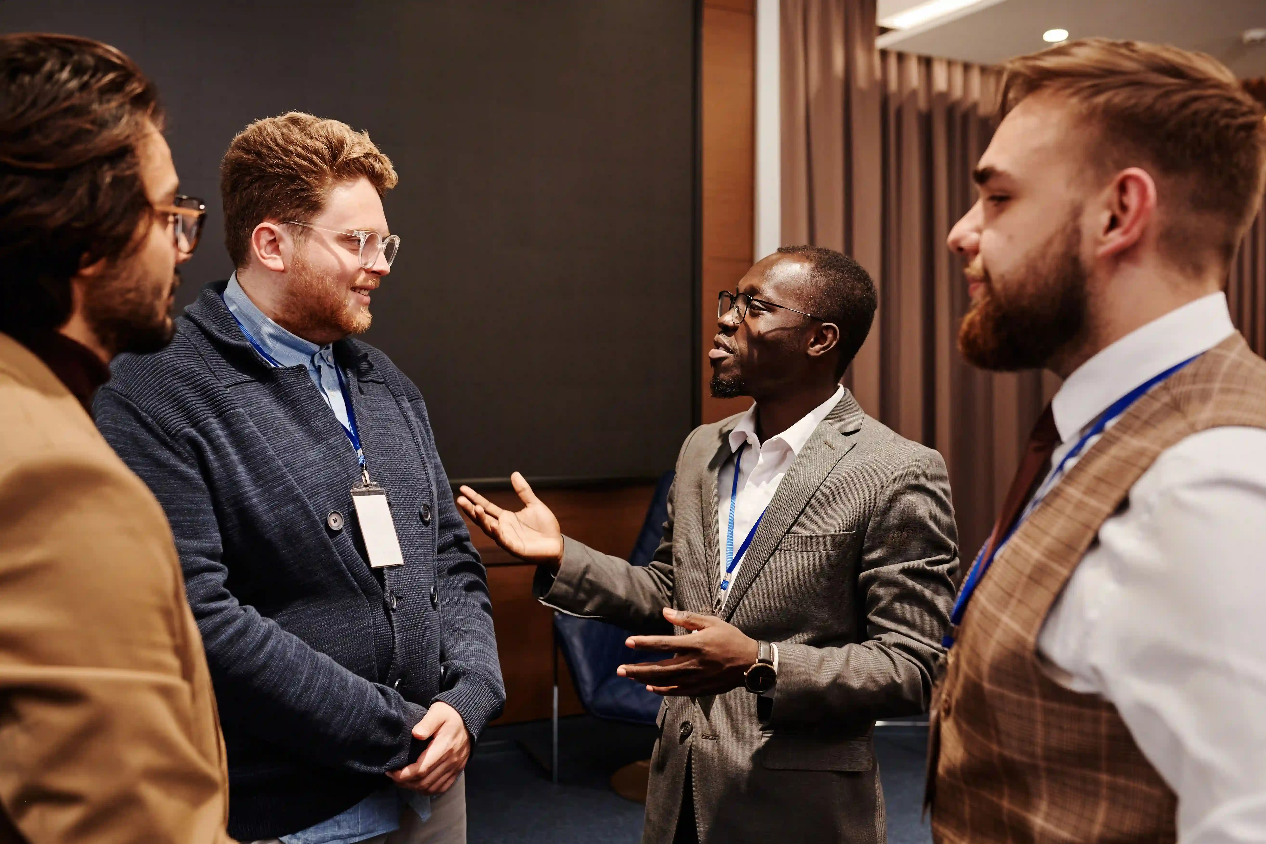 Diverse cross-functional team collaborating closely on a strategic business project in a modern boardroom.